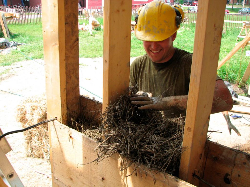Installing straw/clay insulation